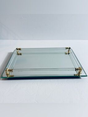 Vintage vanity dresser tray, mirrored base, glass railing, and brass accents.
